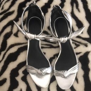 Silver ‘kitten’heel shoe.